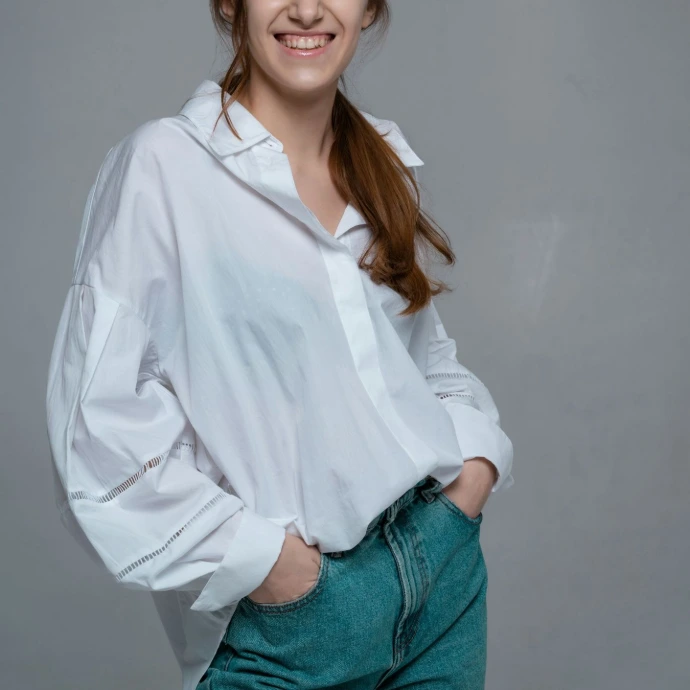 a woman with her arms crossed